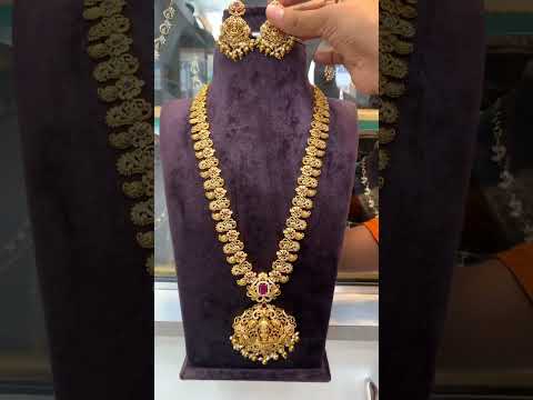 Beautiful nakshi polish long haram with ruby colour stone and God laxmi motive pendant -pairing with beautiful earrings